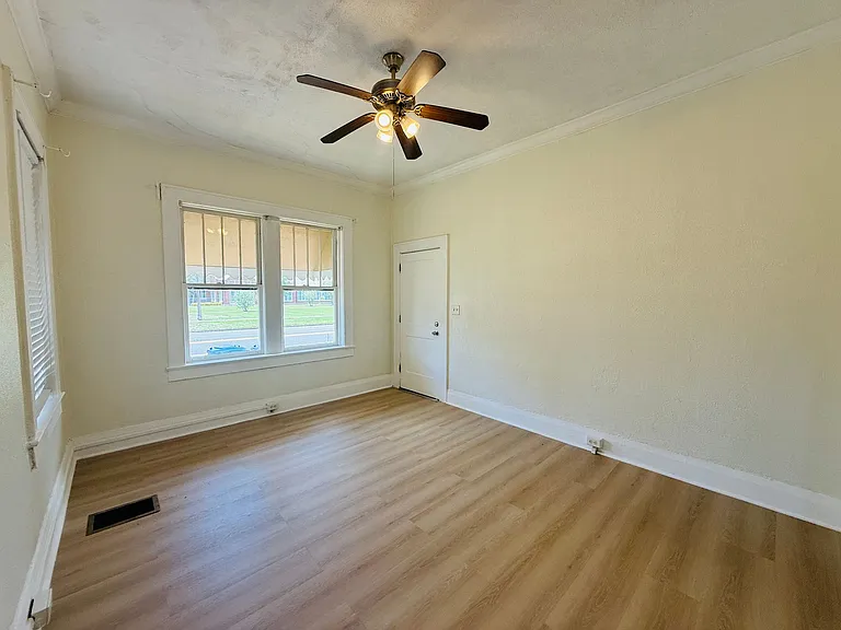 view of the living room with all new luxury vinyl flooring. All windows have blinds.