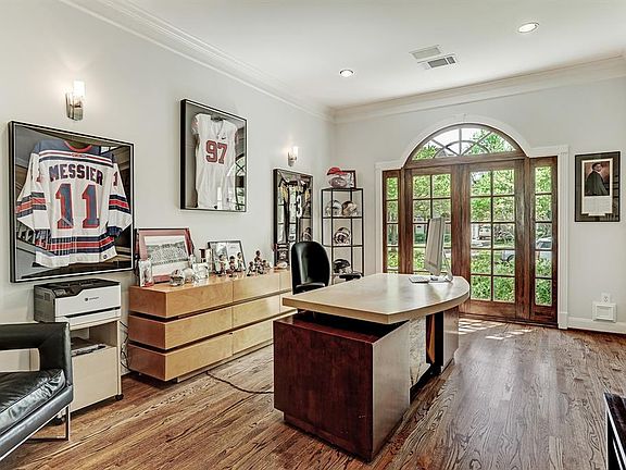 Formal living room or study, new windows, oak floors, opens to family room through French Doors.