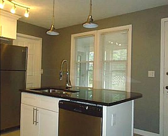 Kitchen island features a dishwasher