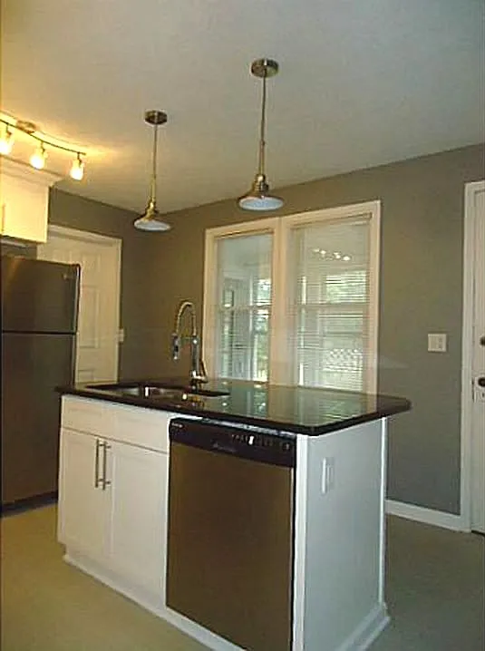 Kitchen island features a dishwasher