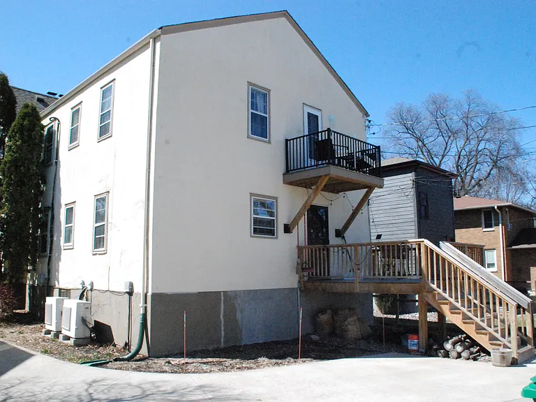 Each unit has separately metered HVAC unit (tied to unit's electric bill), compressors are in photo below windows on south wall just west of downspout. Splits push air into larger bedroom and dining room. Note upper terrace off 2nd floor Master BR.