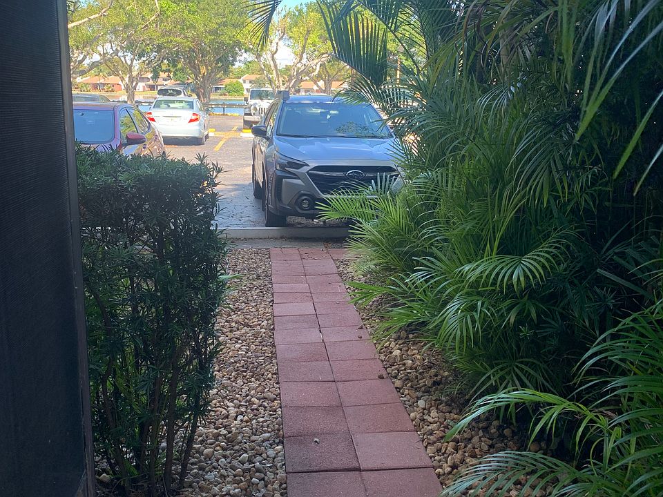 Entrance from the parking lot assigned to the apartment. Allow two cars for 2BD apartment.