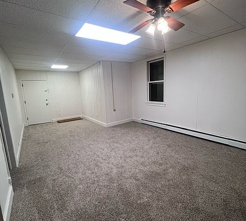 Front door entrance and living room area.