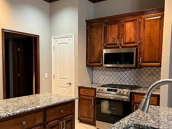 Lighted chef's pantry at left of stove. Updated 5 burner gas stove