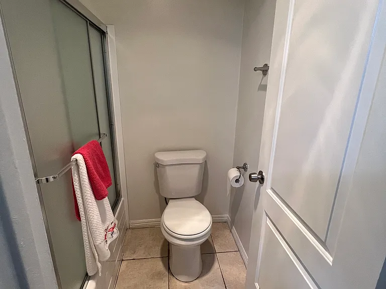 The restroom with bathtub and shower