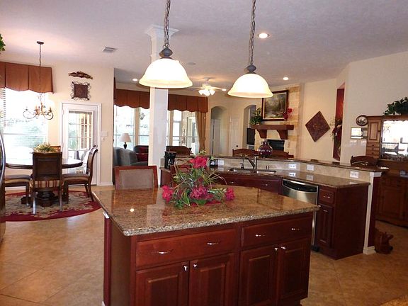 Open Large Island Kitchen Overlooking Den. DePure Filter System for Sink and Refrigerator.