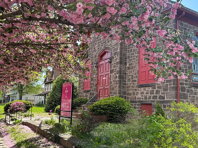 House is located behind small historic church in a park like setting with off street parking.