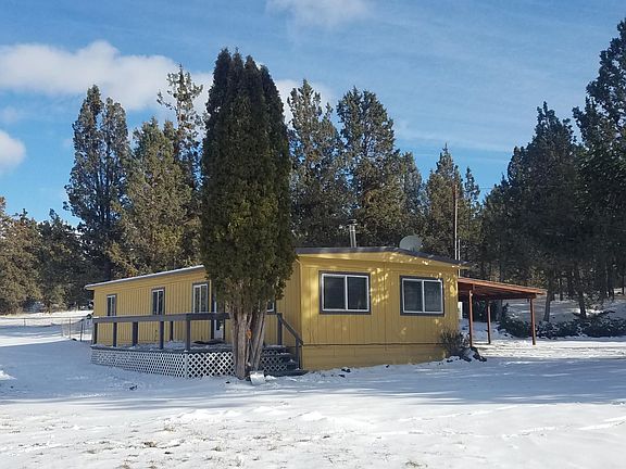 3 bed 2 full bath with added mudroom, deck and covered parki
