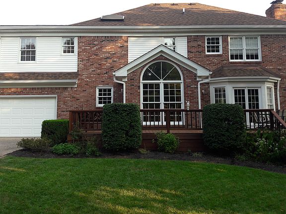 Rear of home w/ deck