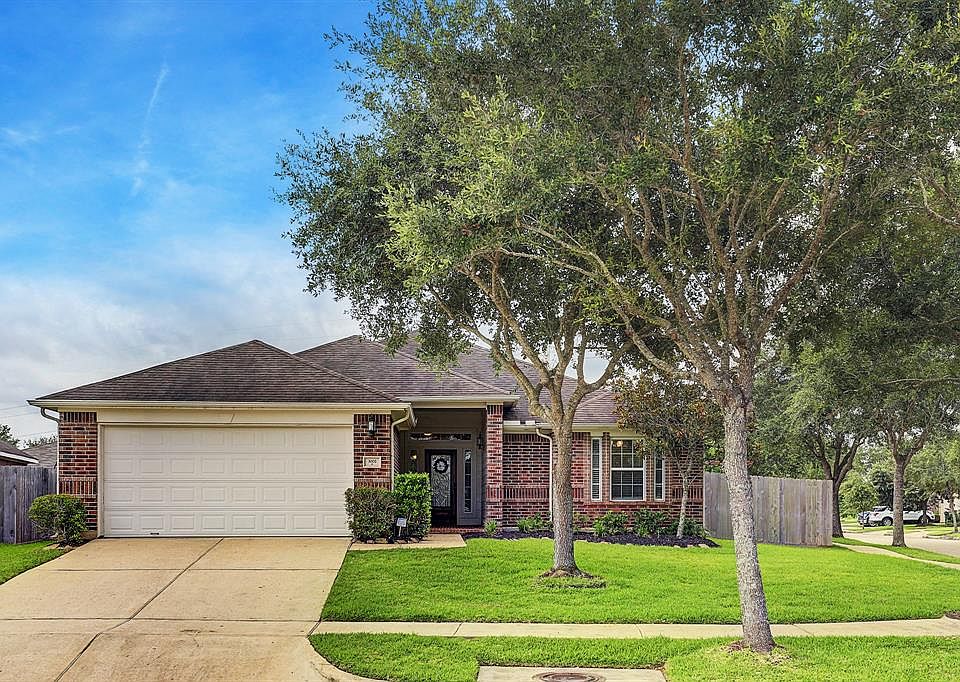 This home is beautiful inside and out! Decorator touches throughout: raised ceilings, hardwood laminate floors, decorator paint, crown molding, updated light fixtures, & tons of natural light from large windows scattered throughout. A large patio in 