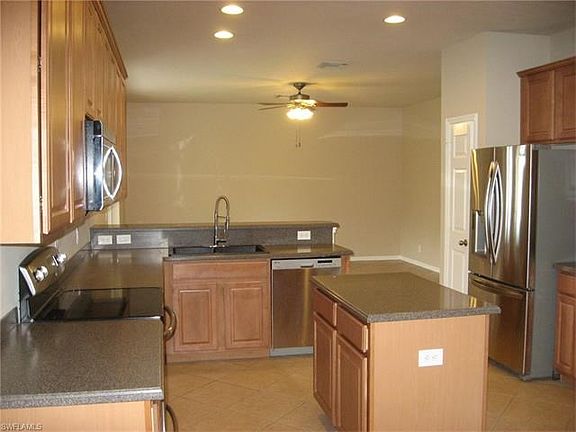 from breakfast room thru kitchen to den/family room