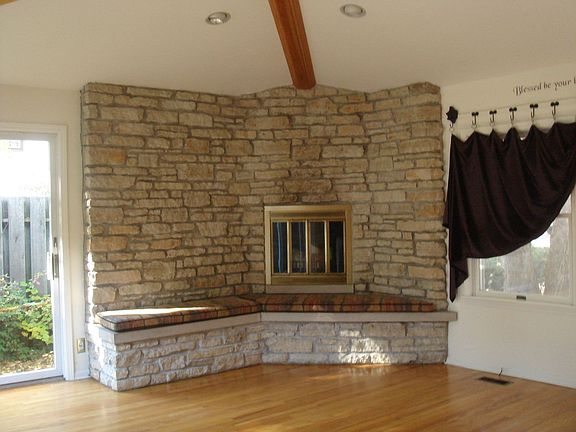 working stone fireplace in family room 
