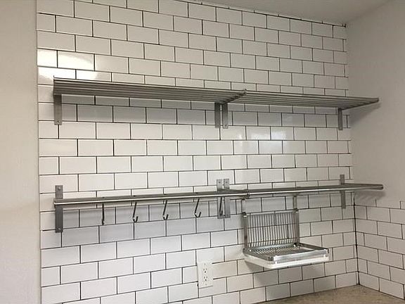 Shelves have been installed in the kitchen