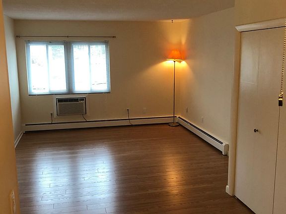 Living room with closet from Dining area