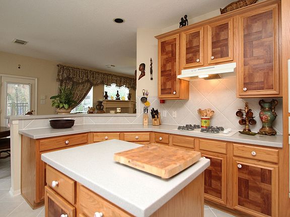 Kitchen features gas range, Corian counter tops and plenty of storage. 