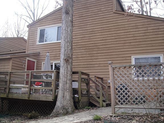 Fenced backyard with a large deck