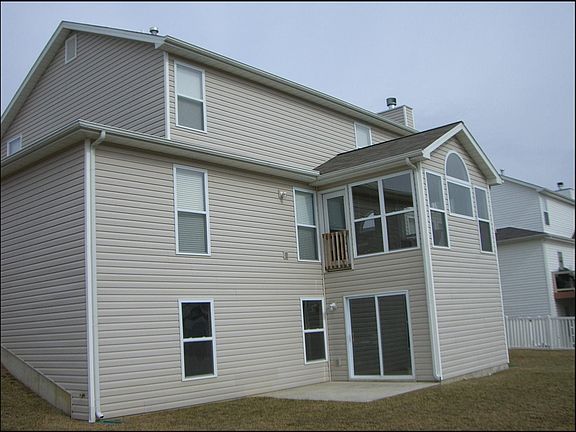 Back view w/ walkout basement
