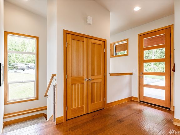 Just inside the front door, warn woods and light welcome you.