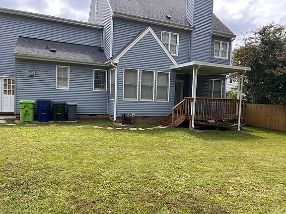 Back view of house and backyard
