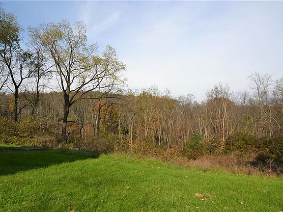 Located on about 1 acre. This is the view of the rear yard.