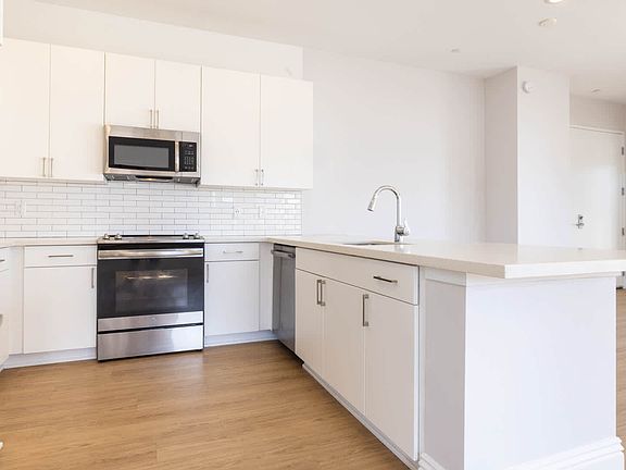 Kitchen with Quartz Countertops and Stainless Steel Appliances
