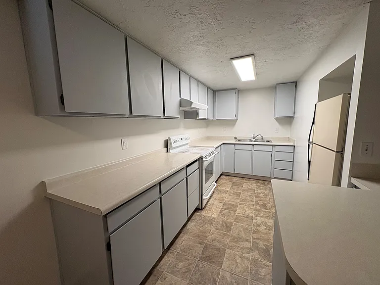 Roomy kitchen is a blank slate, ready for your cozy touch.