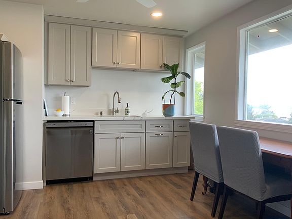 All new kitchen cabinets with soft close doors/drawers, SS dishwasher, large stainless steel sink, quartz countertops.