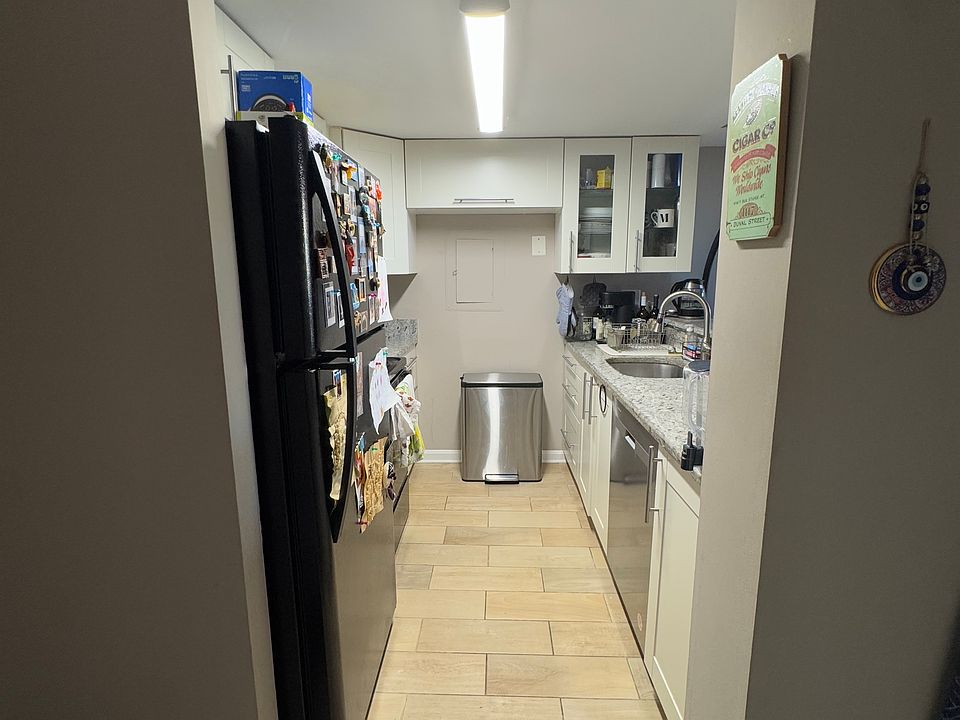 Galley kitchen renovated recently. Dishwasher is less than a year old. Good amount of storage. 

Picture taken from the door to the bathroom. Front door is on the left. Living room/dining room is on the right.