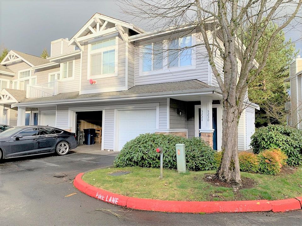 Exterior view. Ground-floor unit on the far right, in the back. Private, attached, single garage (second garage from the right). One car garage + tandem space outside (2 spaces total).