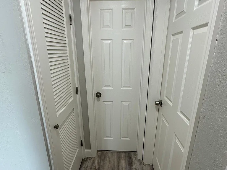Hallway (Doors Left to Right - HVAC Closet, Bathroom, and Bedroom 2)