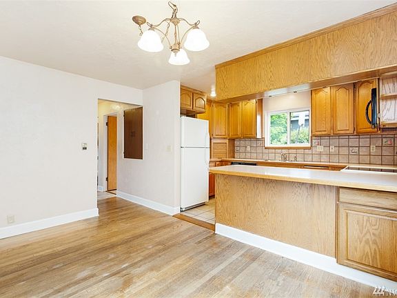 Kitchen with breakfast bar and space for a dining room table! 