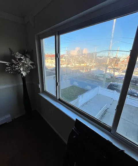LOOK OUT OF LIVING ROOM WINDOW ON BEAUTIFUL NEIGHBORHOOD