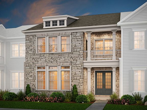 Fairmont Exterior 5 features stone, covered porch and deck, and 2 car rear garage