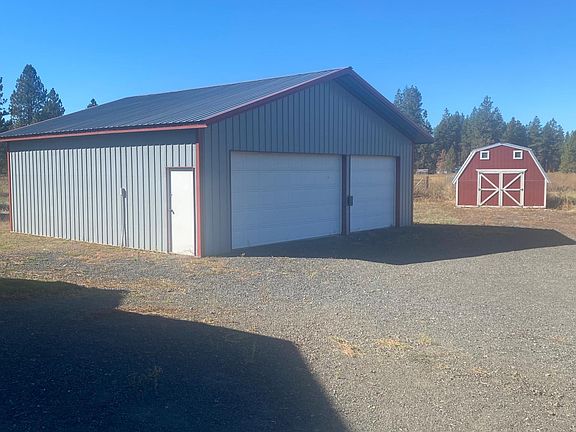 Shop / extra garage. Storage or chicken coupe in red building