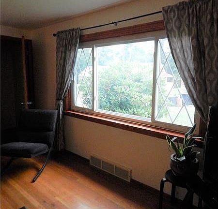 FRONT WINDOW IN THE LIVING ALLOWS FOR GOOD NATURAL LIGHTING.