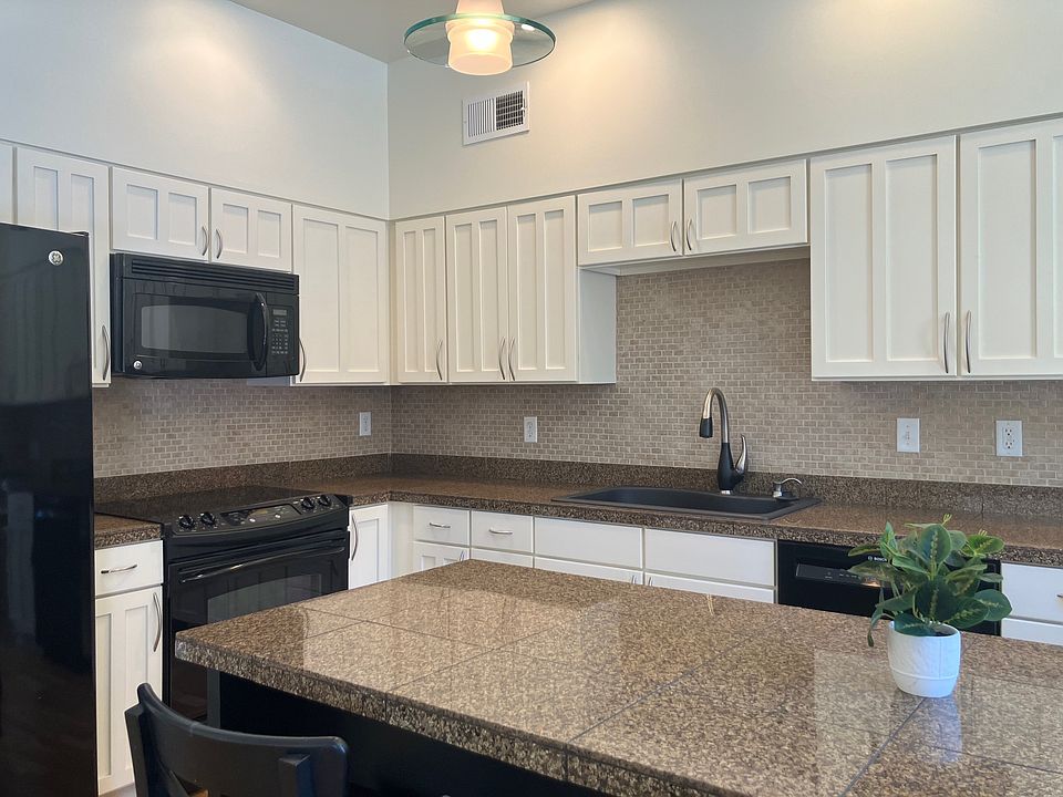 Well-appointed kitchen with fresh paint and new pulls.