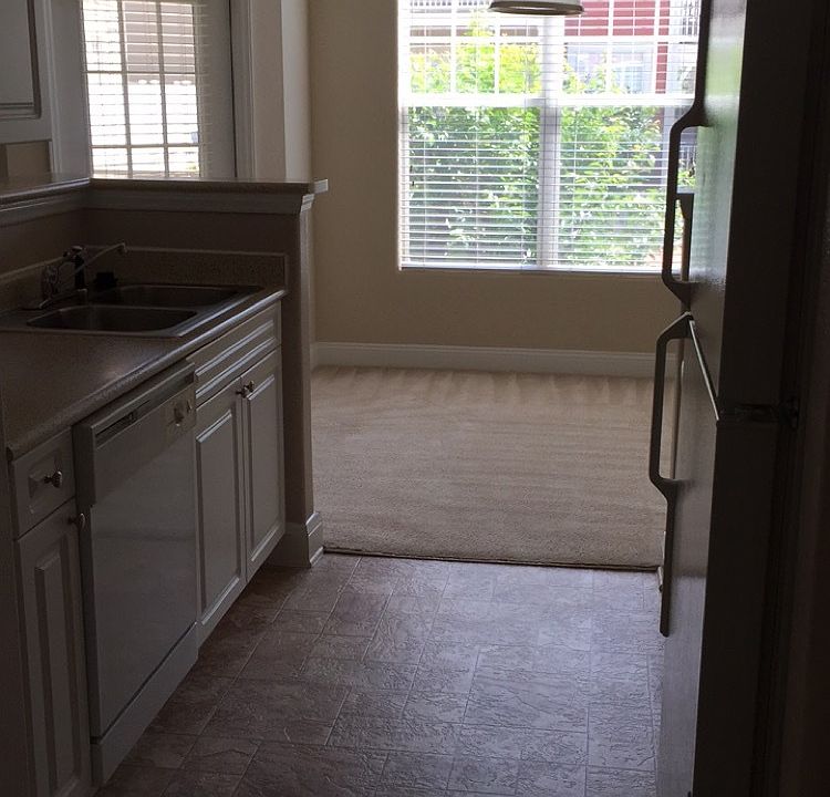 Kitchen to the right when you walk in with dining area