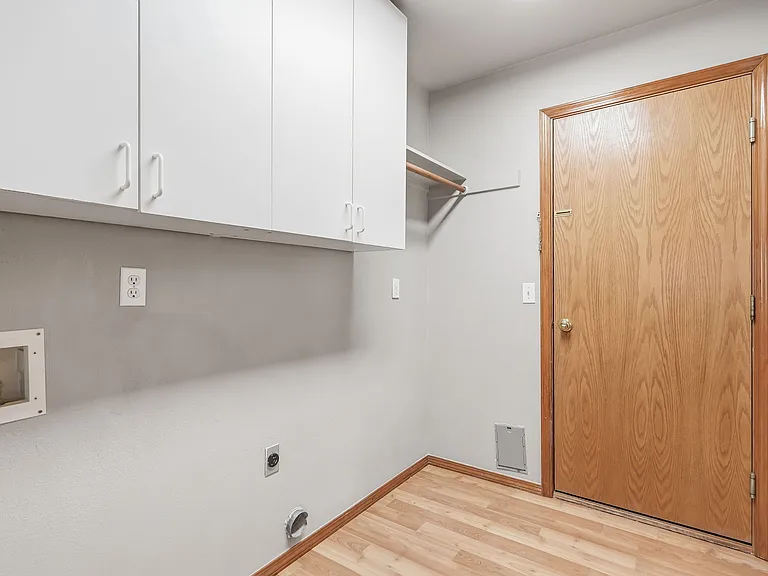 Laundry room with door to garage