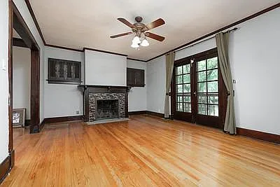 Restored oak flooring in Living Room. Fireplace. Google Fiber. 2 French Doors. Ceiling Fan. Entire interior (upstairs and downstairs) has just been repainted.