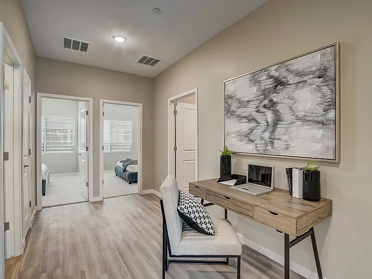 Layout has larger laundry room and open hallway - no flex room