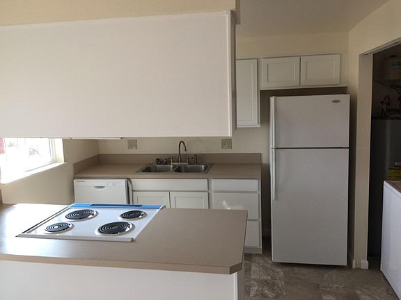 Kitchen has full size washer/dryer in closet