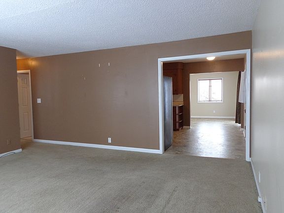 Living Room entry to the Kitchen and Family Room