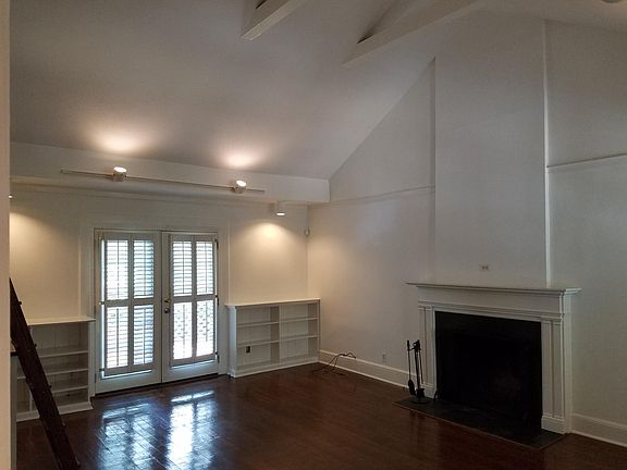 Fireplace, French doors, hardwood floors, vaulted ceiling