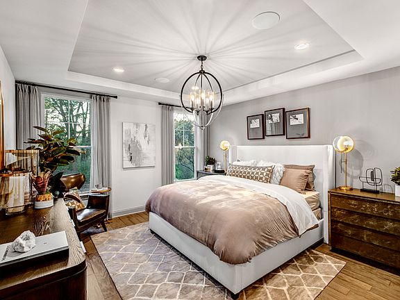 First-floor primary bedroom suite with large walk-in closet