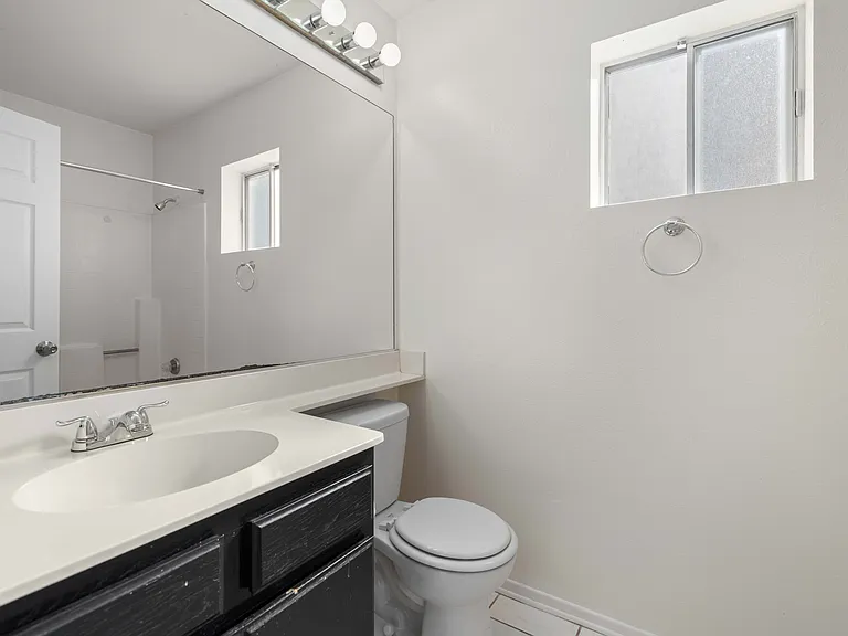 Hallway Bathroom: Shower, Toilet, and Sink