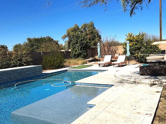 Pebbletec pool with Baja step and umbrella insert