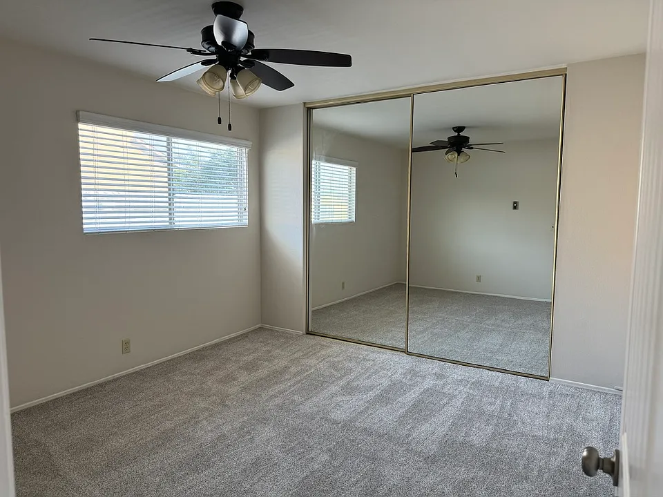 bedroom has mirrored closet doors