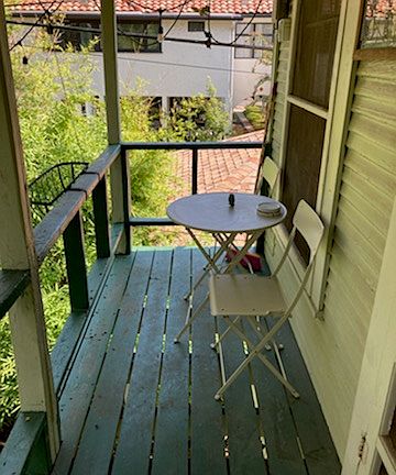 Porch that overlooks big back yard