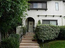 Quaint entrance w/ground floor front patio.