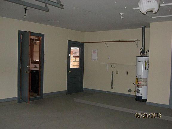 Garage with door to back patio
